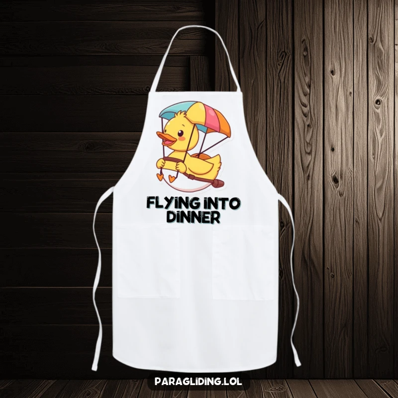 Funny apron with a cheerful duck enjoying the view from its colorful paraglider, perfect for kitchen adventures.