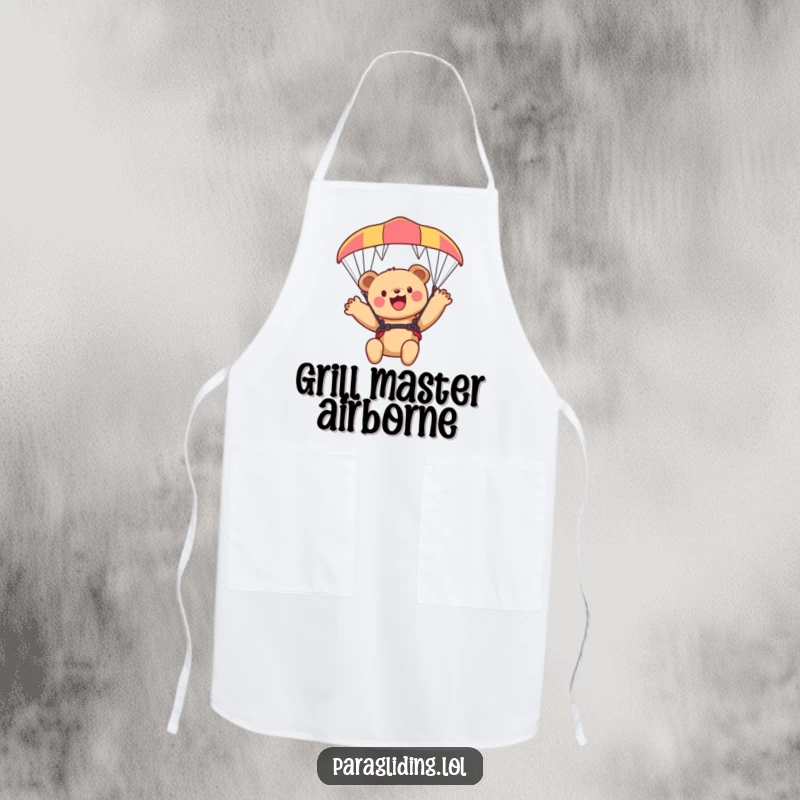 Funny bear cub apron, a kitchen garment with a cub waving from a paraglider, perfect for chefs.