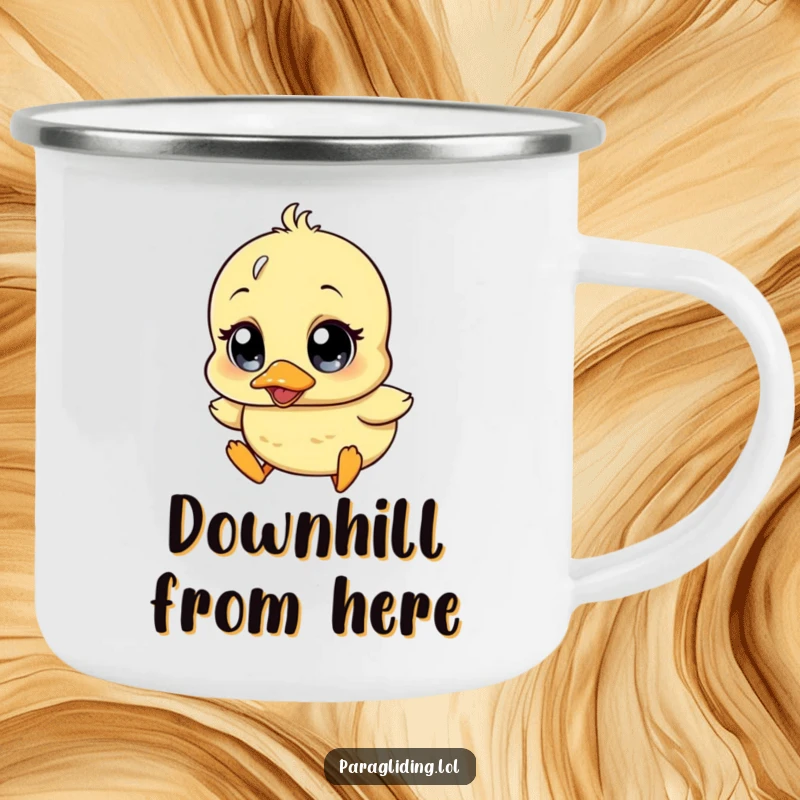 Funny enamel camping mug showcasing a wobbly duckling character with comically wide surprise eyes, drifting downwards, perfect for outdoors.