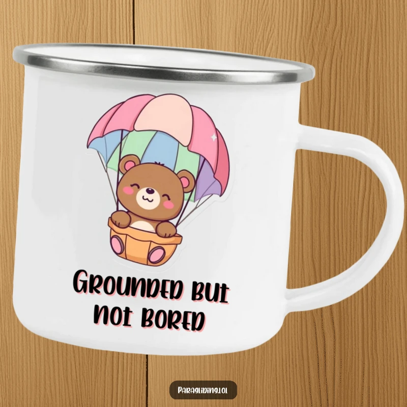 Funny camping mug with a happy bear floating peacefully in a colorful parachute, perfect for serene outdoor enjoyment, excellent funny gift.