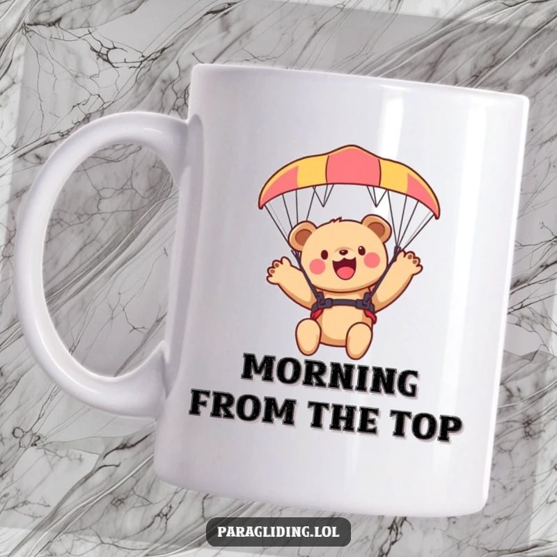 Funny bear cub mug, a cute cub joyfully waving from a paraglider high in the sky, perfect for adventurers.