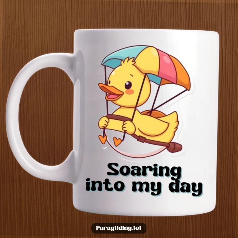 Funny mug with a cheerful duck enjoying the view from its colorful paraglider, symbolizing freedom and fun.