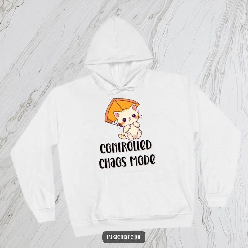 Funny determined cat floats gently, clutching its paraglider, a cozy hoodie for focused, adventurous souls.