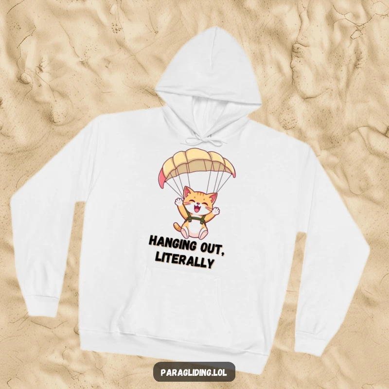 Cozy funny hoodie with a giggling cat paragliding, offering warmth and a spirit of playful adventure.