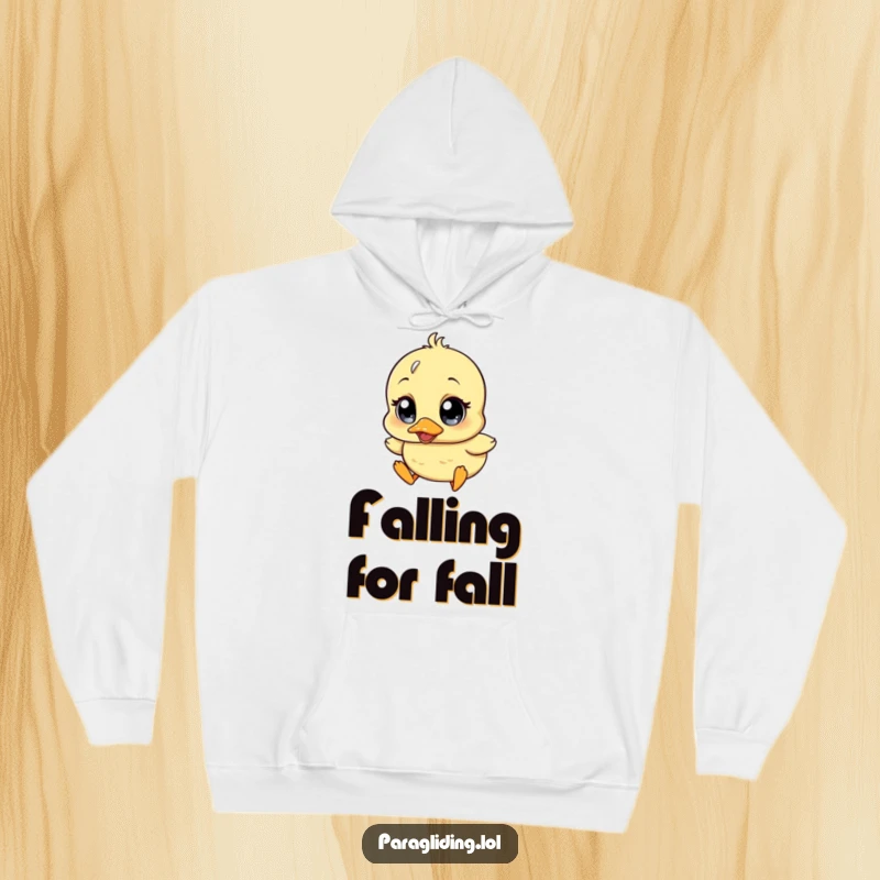 Funny hoodie featuring a charmingly wobbly duckling character with wide surprise eyes, descending in a comical manner.