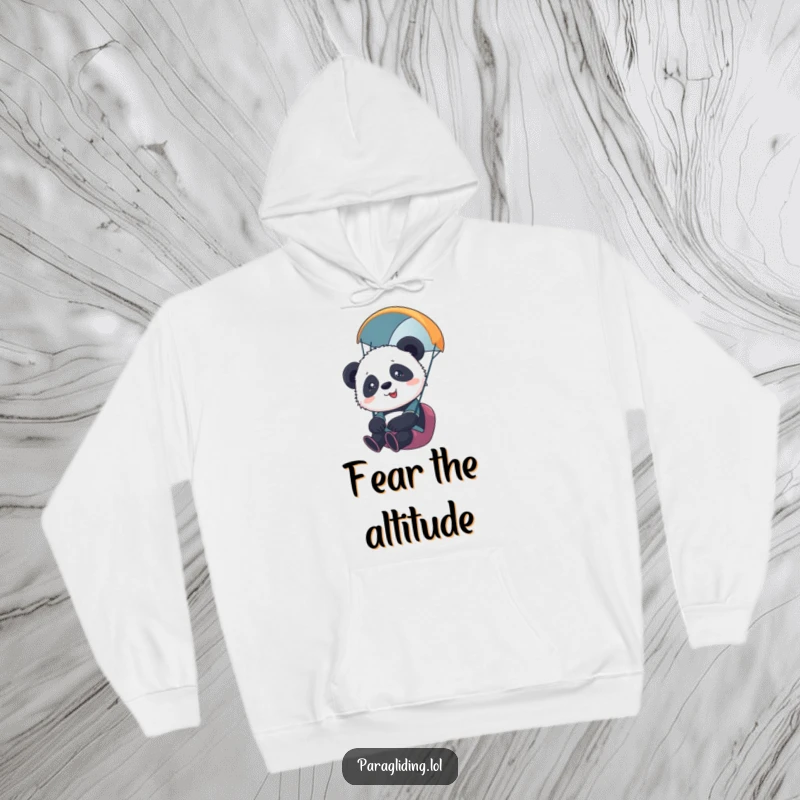 Funny hoodie with a cute panda cub paragliding, appearing overwhelmed yet content during its aerial adventure. Great gift.