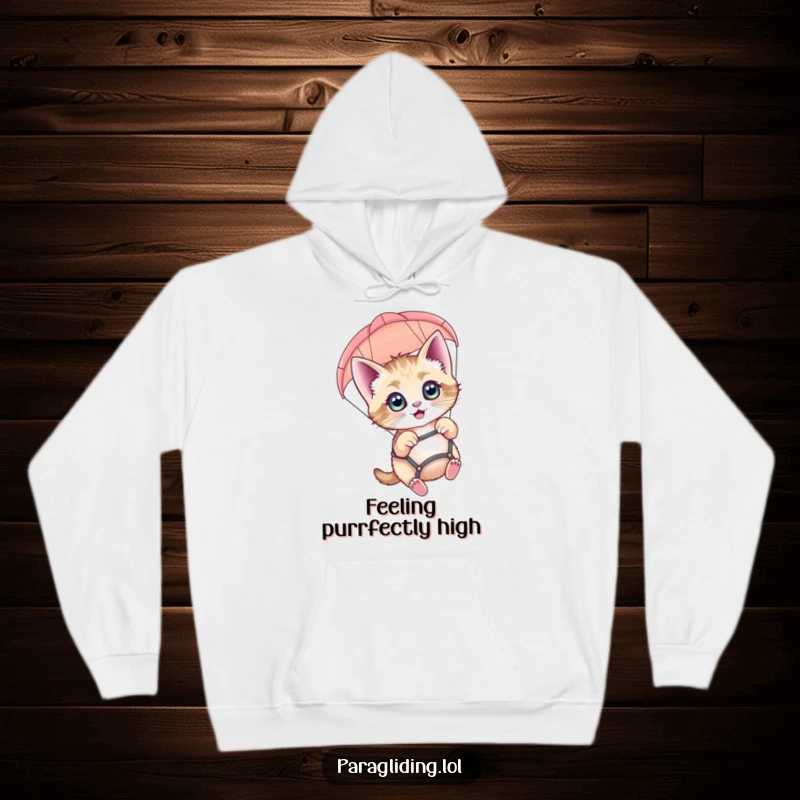 Funny paragliding kitten hoodie featuring a wide-eyed, happy cat soaring through the sky in a paraglider.