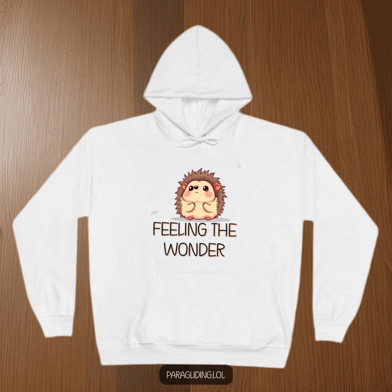 Funny hoodie featuring a hedgehog looking completely awestruck at the expansive view below, offering cozy humor.
