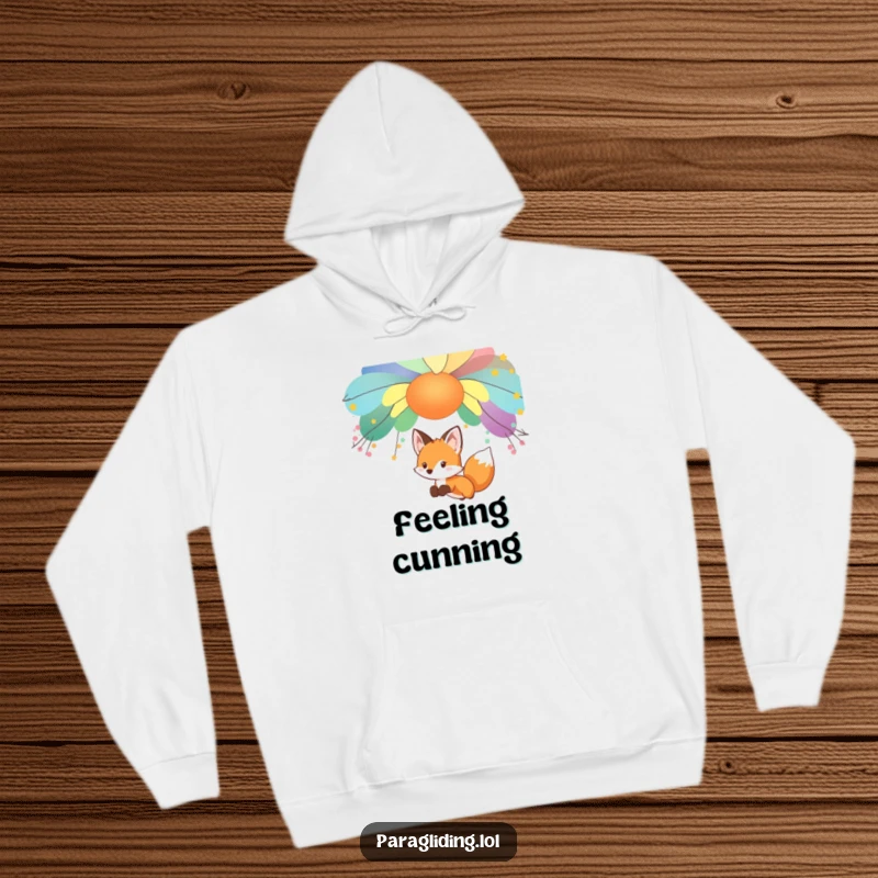 Funny curious fox, gliding under a colorful canopy, on a cozy hoodie, perfect funny gift.