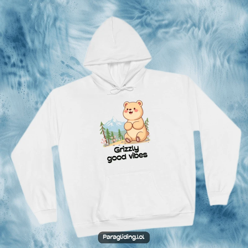Funny hoodie with a beaming bear admiring a serene mountain view, providing cozy warmth and outdoor spirit.