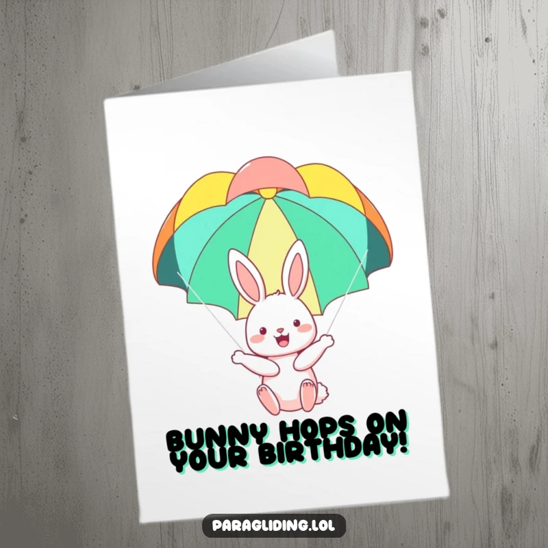 Funny Free Printable Birthday Card: A happy bunny floating serenely under a colorful parachute, celebrating joyfully.