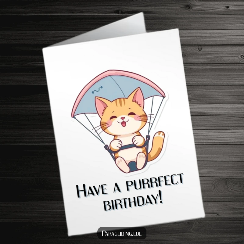 Funny Free Printable Birthday Card: A supremely confident cat expertly pilots a paraglider with a nimble, graceful presence, soaring through the sky.