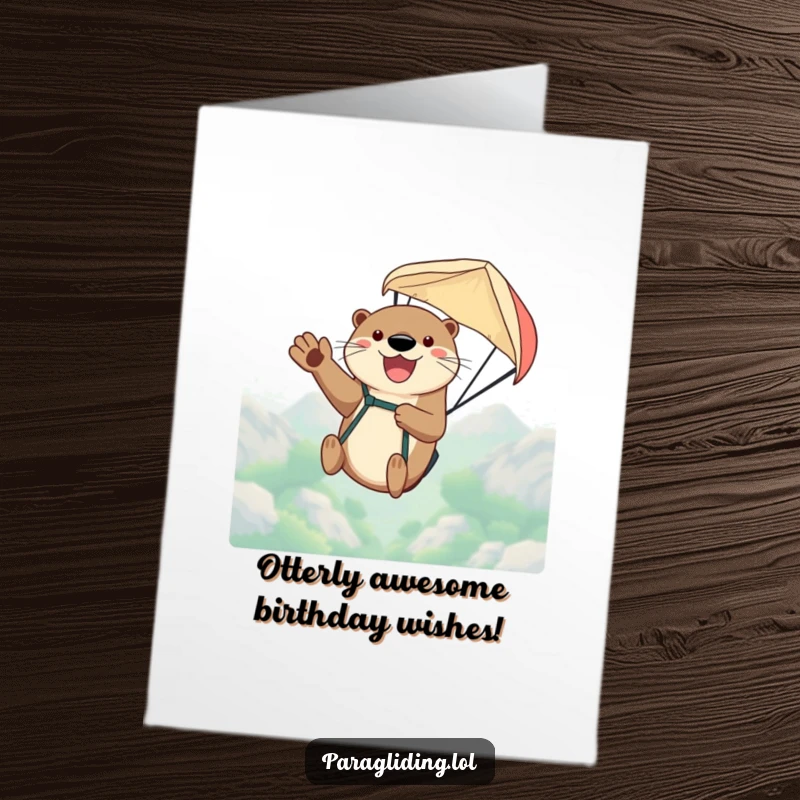 Funny Free Printable Birthday Card: Happy otter waving joyfully while paragliding high in the sky.