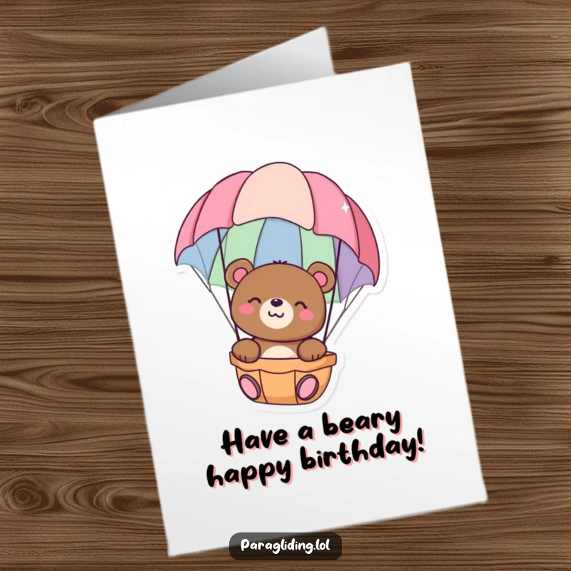 Funny Free Printable Birthday Card featuring a happy bear calmly floating down in a colorful parachute, enjoying the ride.
