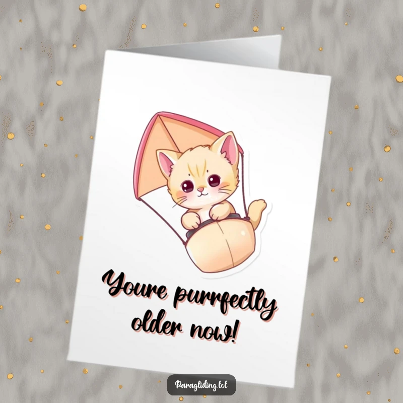 Funny Free Printable Birthday Card: Curious kitten paragliding with a tiny parachute, ready for a birthday adventure.