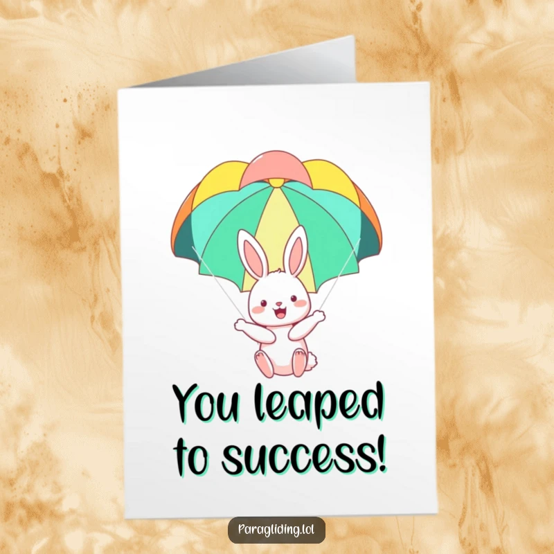 Funny Free Printable Congratulations Card: A happy bunny floating under a parachute, representing a smooth success.