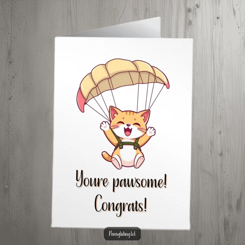 Funny Free Printable Congratulations Card of a giggling cat joyfully waving from under a spacious paraglider canopy, celebrating an achievement.