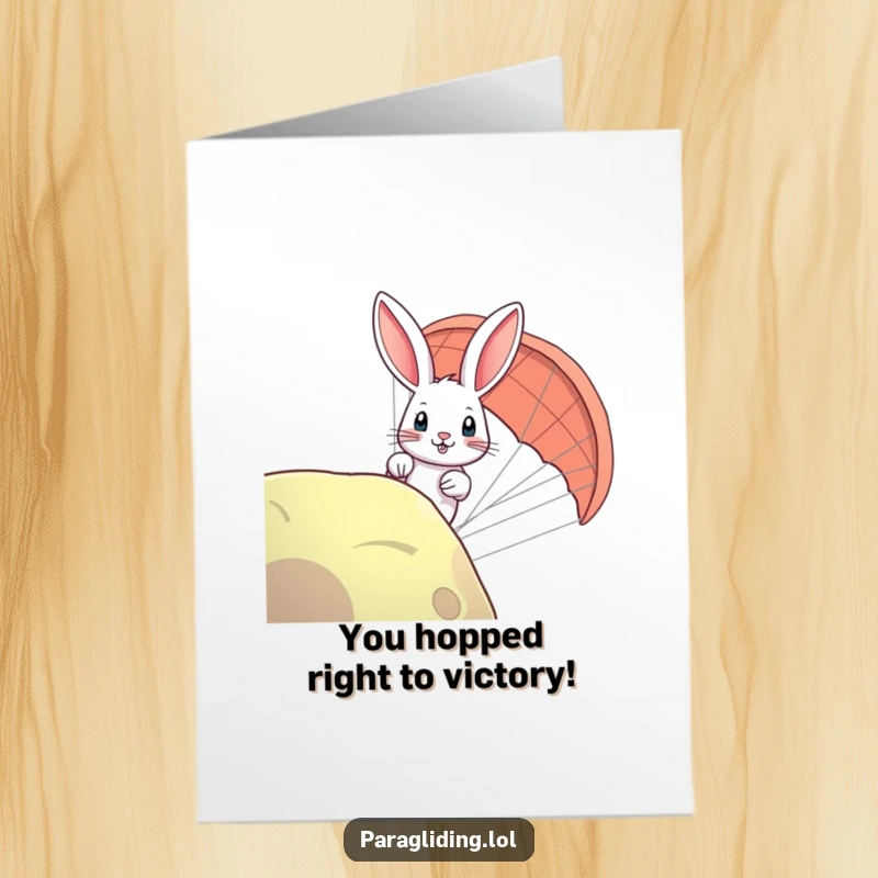 Funny Free Printable Congrats card: A curious rabbit peeking over the edge of a paraglider, showing excitement for their achievement.