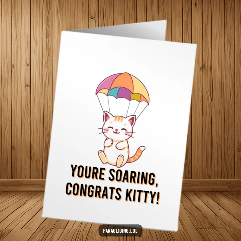 Funny Free Printable Congratulations Card: A content cat enjoying the view while paragliding, celebrating a successful achievement with ease.