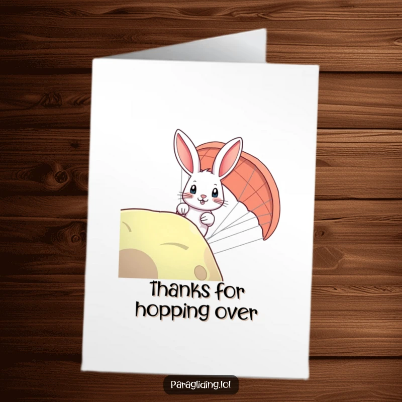 Funny Free Printable Thank You card: A curious rabbit peeking over the edge of a paraglider, conveying thanks with charm.