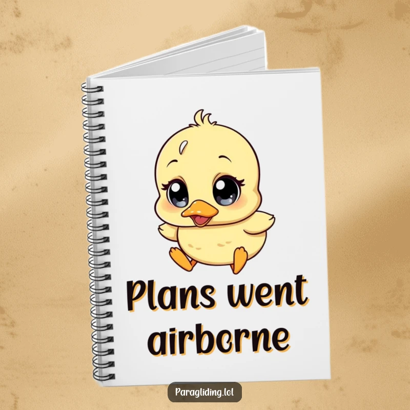 Funny notebook with lined pages, featuring a wobbly duckling character with wide surprise eyes, drifting downwards, ideal for journaling.