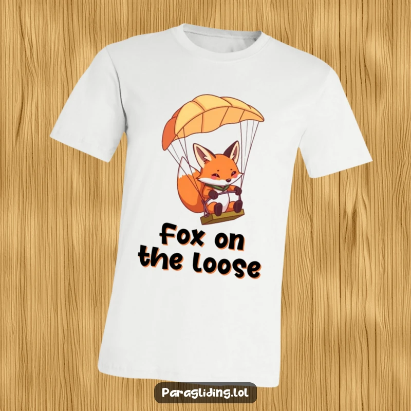 Funny determined fox paragliding t-shirt, showing a fox concentrating hard while steering a paraglider.