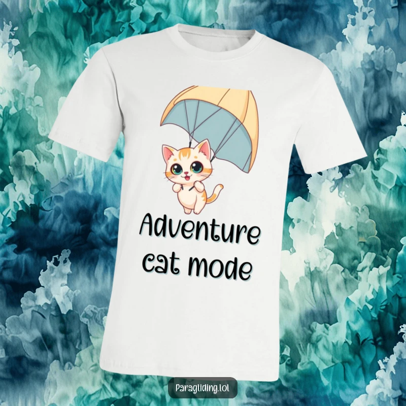Funny t-shirt featuring a curious cat dangling from a paraglider with wide eyes, embodying thrilling adventure and feline bravery, an excellent funny gift.