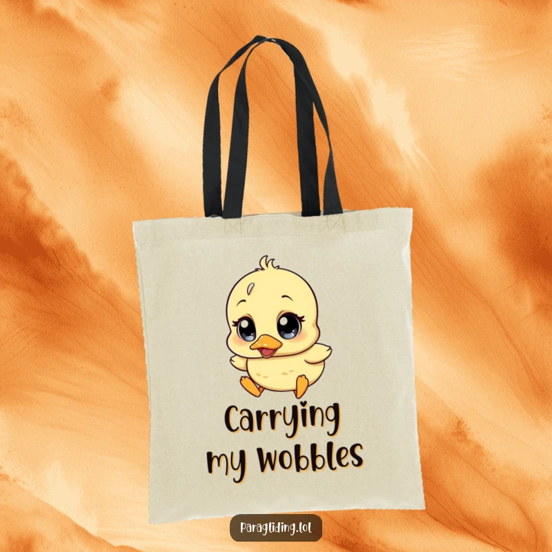 Funny tote bag depicting a wobbly duckling character with comically surprised eyes, drifting downwards, perfect for groceries or books.