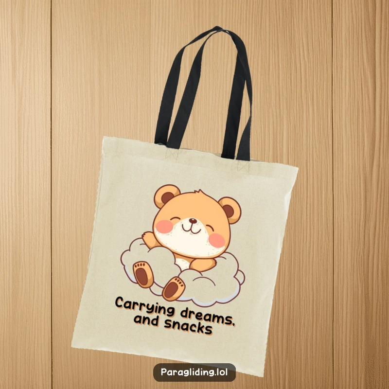 Funny tote bag with a delighted bear floating peacefully on fluffy clouds, perfect for carrying your sunny disposition.