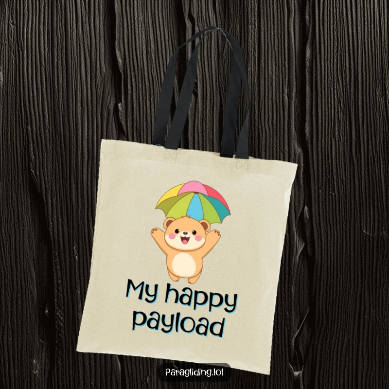 Funny tote bag featuring a joyful, round bear cub paragliding with a colorful canopy, perfect for carrying daily items with a sense of fun.
