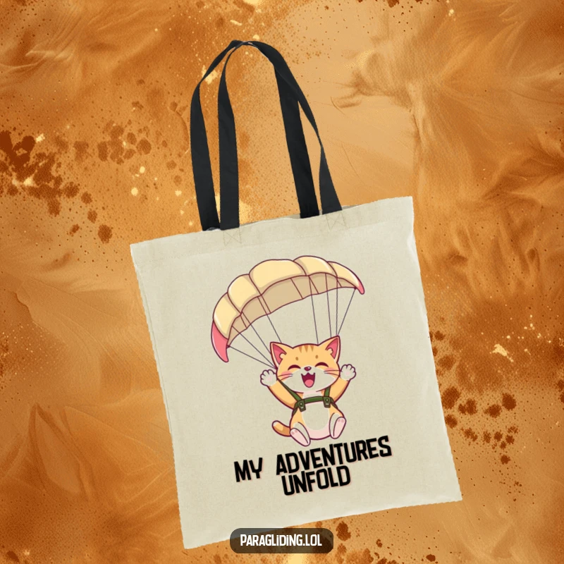 Funny tote bag with a giggling cat waving from under a paraglider, perfect for carrying essentials with joy.