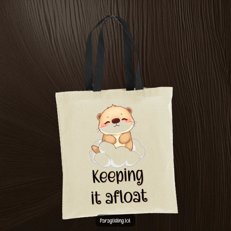 Funny tote bag featuring a happy, fluffy otter drifting peacefully among fluffy clouds, perfect for carrying daily items with a touch of serene charm.
